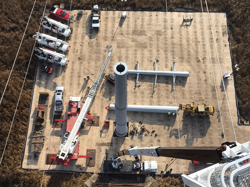 Aerial view of a utility site with composite matting creating a temporary roadway/access