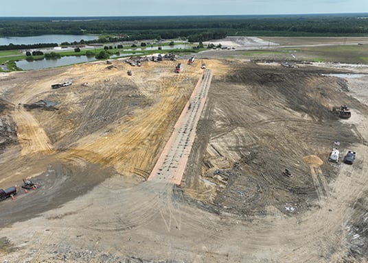 Heavy-duty construction mats for landfills