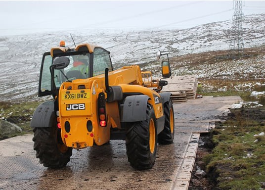 Composite mat temporary roadway