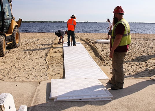Beach access mats and portable beach walkways