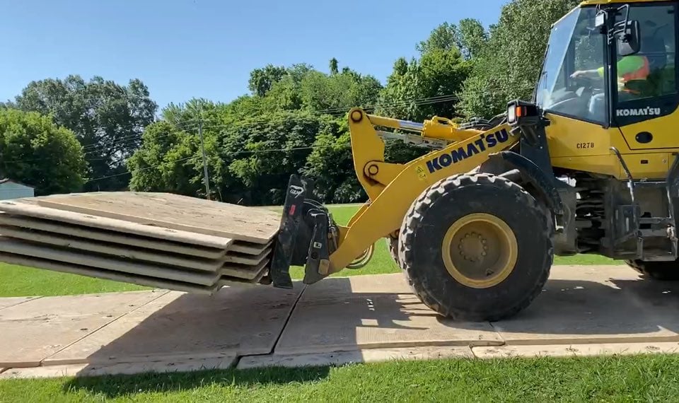 Composite mats for construction equipment